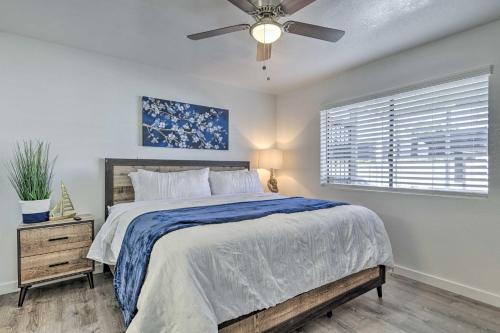 a bedroom with a bed and a ceiling fan at Downtown Gilbert Condo with Screened Porch! in Gilbert