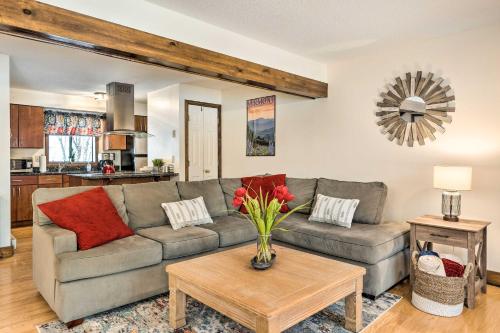 a living room with a couch and a table at Hartford Escape with Fire Pit about 3 Mi to Ski and Golf! in Hartford