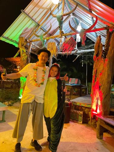 a man and a woman standing under a tent at Freedom home in Ko Chang