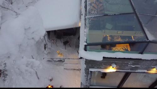 an aerial view of a building covered in snow at Levi Secret Igloo Ruska in Levi
