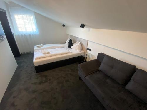 Кровать или кровати в номере The Place Boutique & Design Hotel Flachau