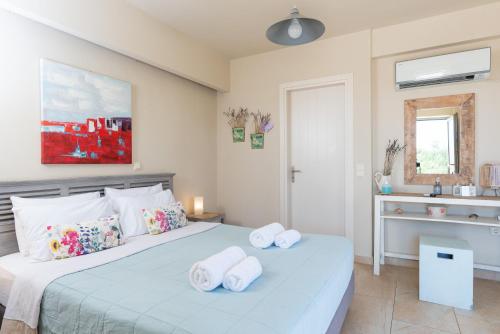 Katil atau katil-katil dalam bilik di Aelia Home Suites