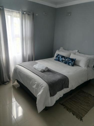 Ένα ή περισσότερα κρεβάτια σε δωμάτιο στο Goshen Place