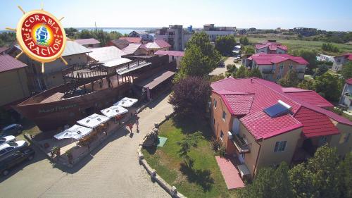 an overhead view of a building with a sign and cars at Club de Vacanta Corabia Piratilor - Family Resort Mamaia Nord in Mamaia Nord