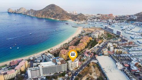 an aerial view of a beach with a yellow sign at Ocean view 4 min walk to Medano Beach in Cabo San Lucas