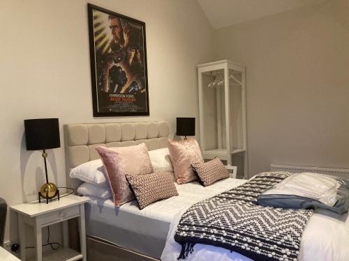 a bedroom with a bed and a poster on the wall at Clara Lodge in Sallins