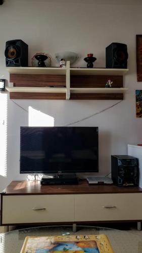 a desk with a computer monitor on top of it at Apart 32 Govedartsi Forest View in Govedartsi