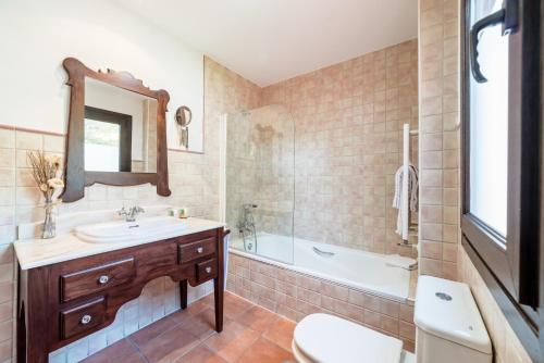 a bathroom with a sink and a tub and a toilet at Hotel Boutique Cerro del Sol Adults only recommended in Granada