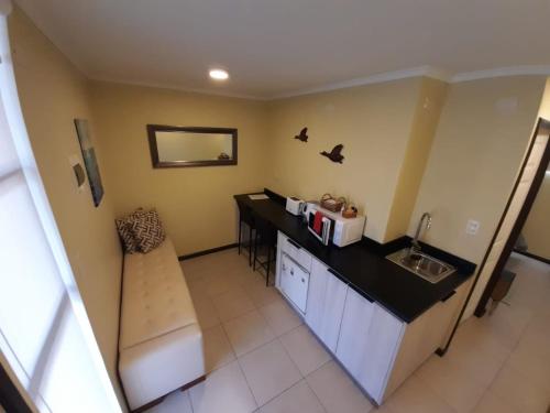 a kitchen with a counter top and a sink at Holiday Homes Cabañas El Vergel in Osorno