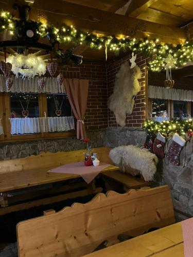 a dining room with a table and christmas lights at Mała Bawaria in Zakopane