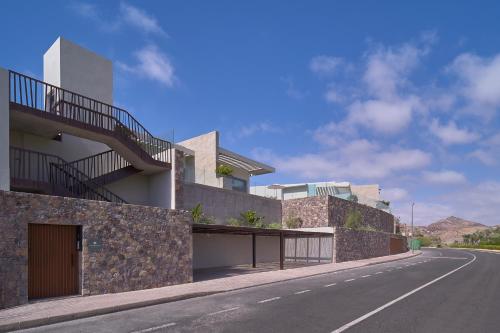 a house on the side of a road at Salobre Oasis Suites in Salobre