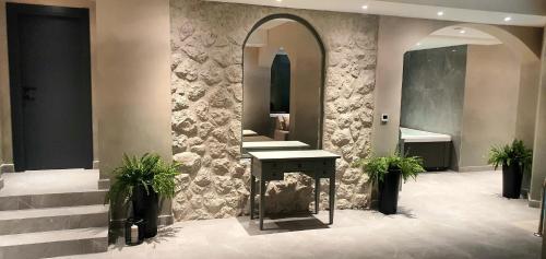 a bathroom with a sink and a mirror at Boutique Hotel Acacia in Lovran