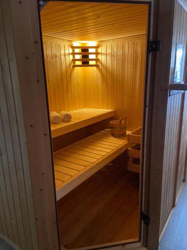 a small wooden sauna with a light in it at Ferienhaus Elisa in Trittenheim