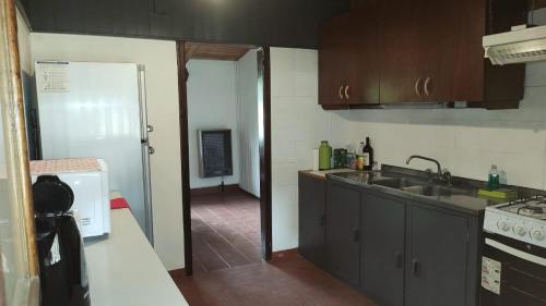 A kitchen or kitchenette at Cabaña KM 12