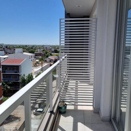 a balcony with a view of a city at AZ Suites Resistencia in Resistencia
