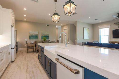 a large kitchen with a sink and a counter top at All Decked Out in Bailey Hall