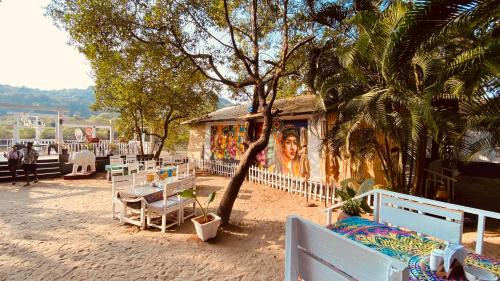 a building with a painting on the side of it at Dreamcatcher By Brifton Hotel And Resorts in Palolem