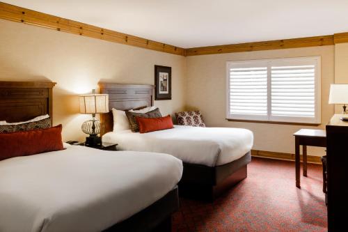 a hotel room with two beds and a window at Tenaya Lodge at Yosemite in Fish Camp