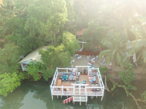 an aerial view of a house on the water at Dreamcatcher By Brifton Hotel And Resorts in Palolem