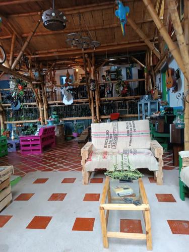 a store with a couch and a table in a room at Hostel Camelot Salento in Salento