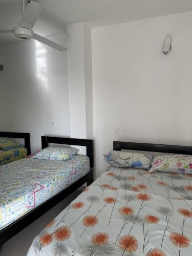 Postel nebo postele na pokoji v ubytování Hotel Cangrejalito