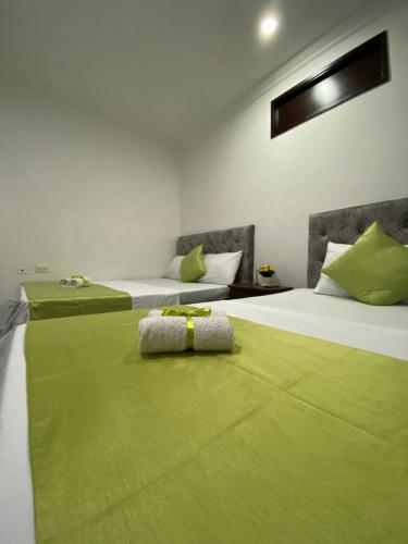 Postel nebo postele na pokoji v ubytování Hotel Orquídea Real