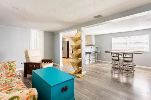 a living room with a couch and a table at Heights Haven in Tampa