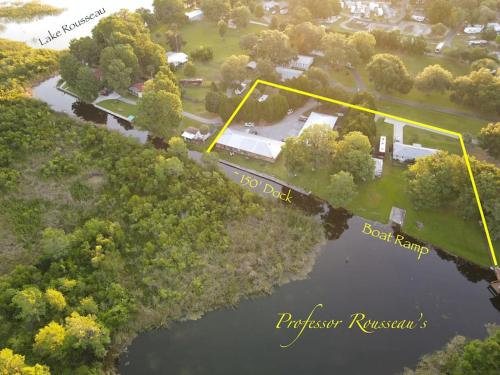 an aerial view of a park with a lake and trees at Professor Rousseau's Manatee Bay in Crystal River