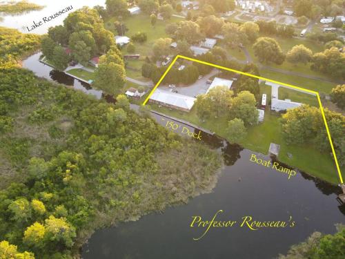an aerial view of a park and a lake at Professor Rousseau's Fishing RV Retreat in Crystal River