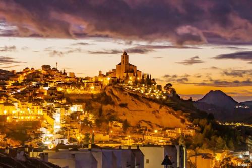 a view of a city at night at Casa La Serena in Iznájar