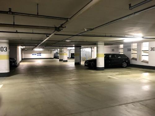 an empty parking garage with cars parked in it at Apartments am Neuen Theater - Altstadt - Zentral - Küche - Wifi - Powered by Ko-Living in Halle an der Saale
