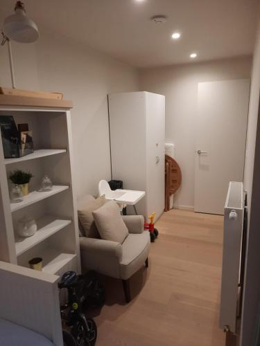 a living room with a couch and a table at lectus IV in Nieuwpoort