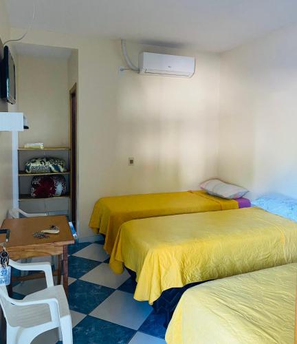 Una cama o camas en una habitación de Pousada 277