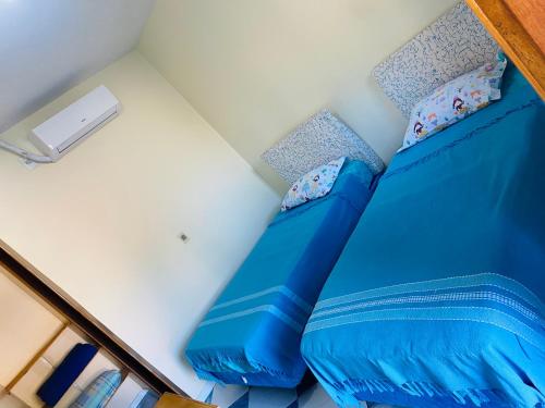 Una cama o camas en una habitación de Pousada 277