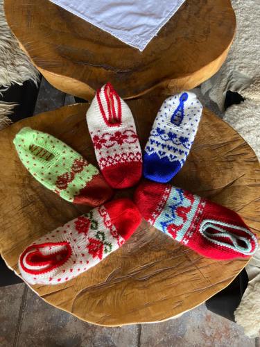 a wooden plate with four pairs of socks on it at Konak Umoljani in Umoljani