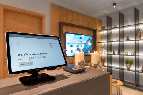 a computer monitor sitting on top of a desk at zeitlang by Rösslwirt in Lam