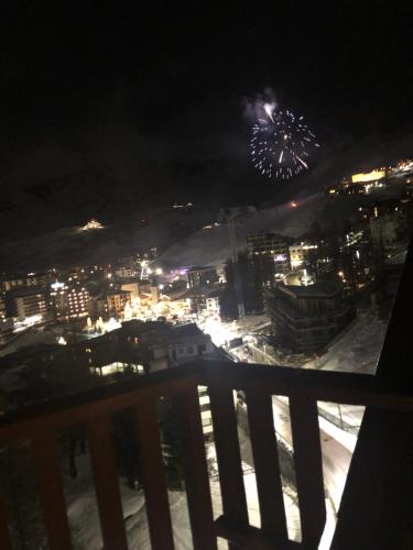a view of a city at night with fireworks at Eagle's Nest in Breuil-Cervinia