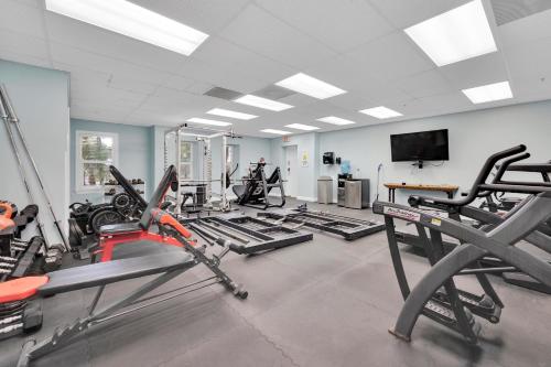 a gym with several treadmills and cardio machines at Indigo Reef Resort in Marathon