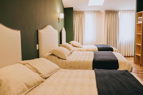 Ένα ή περισσότερα κρεβάτια σε δωμάτιο στο Anden Inca Hotel