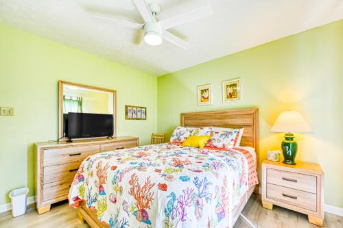 a bedroom with a bed and a flat screen tv at Seashore's Best in North Topsail Beach