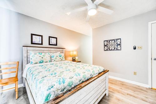 a bedroom with a bed and a ceiling fan at Seashore's Best in North Topsail Beach