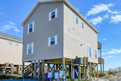 a large house on a wooden dock at Seashore's Best in North Topsail Beach