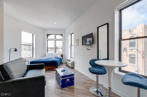 a living room with a couch and a table at Chicago Third Floor Studio by 747 Lofts in Chicago