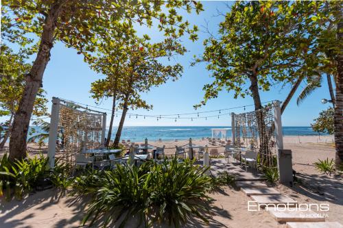 an outdoor wedding ceremony on the beach at Beach Apartment Villas Jubey, Emotion access in Juan Dolio