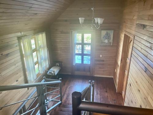 an empty room with wooden walls and a window at Cabañas el Chalet in Morelia