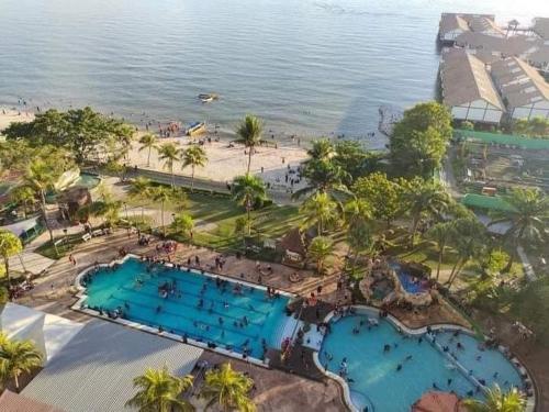 an aerial view of a resort with two swimming pools at Sharaa seaview Apartment in Port Dickson