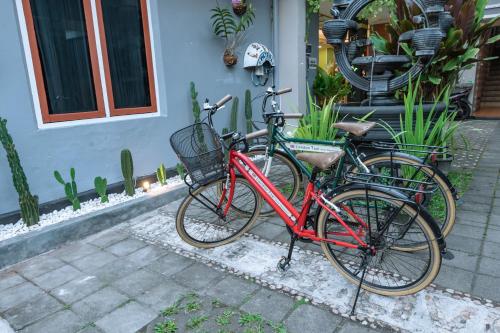 two bikes parked next to each other in front of a house at Metro Malioboro Living in Yogyakarta