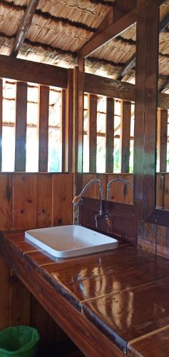 a bathroom with a sink in a wooden room at Kohjum Freedom Resort in Ko Jum