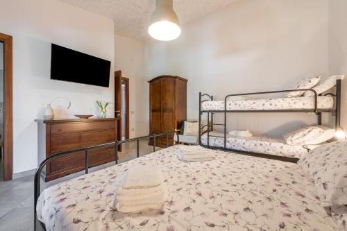 Ένα ή περισσότερα κρεβάτια σε δωμάτιο στο Villa Eleonora Residence App to 1