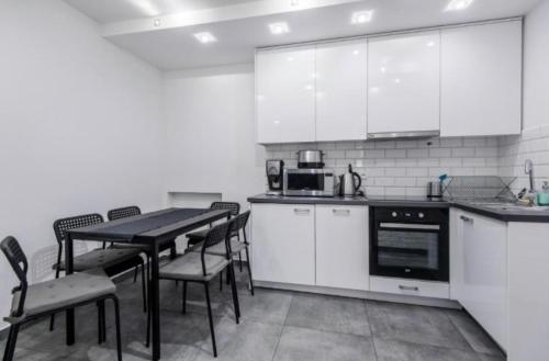 Kuchyňa alebo kuchynka v ubytovaní White Apartment